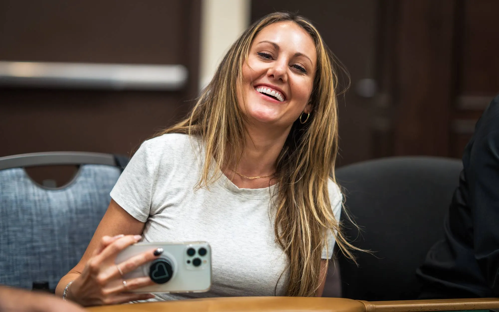 Lexy Gavin-Mather laughing at a tournament table